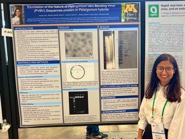 Sita Paudel presents research on a poster at 2022 APS
