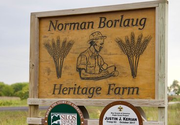 roadside sign in iowa for norman borlaug heritage farm